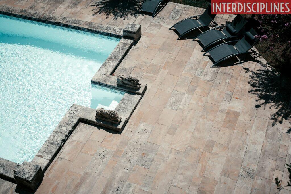 a pool with chairs around it