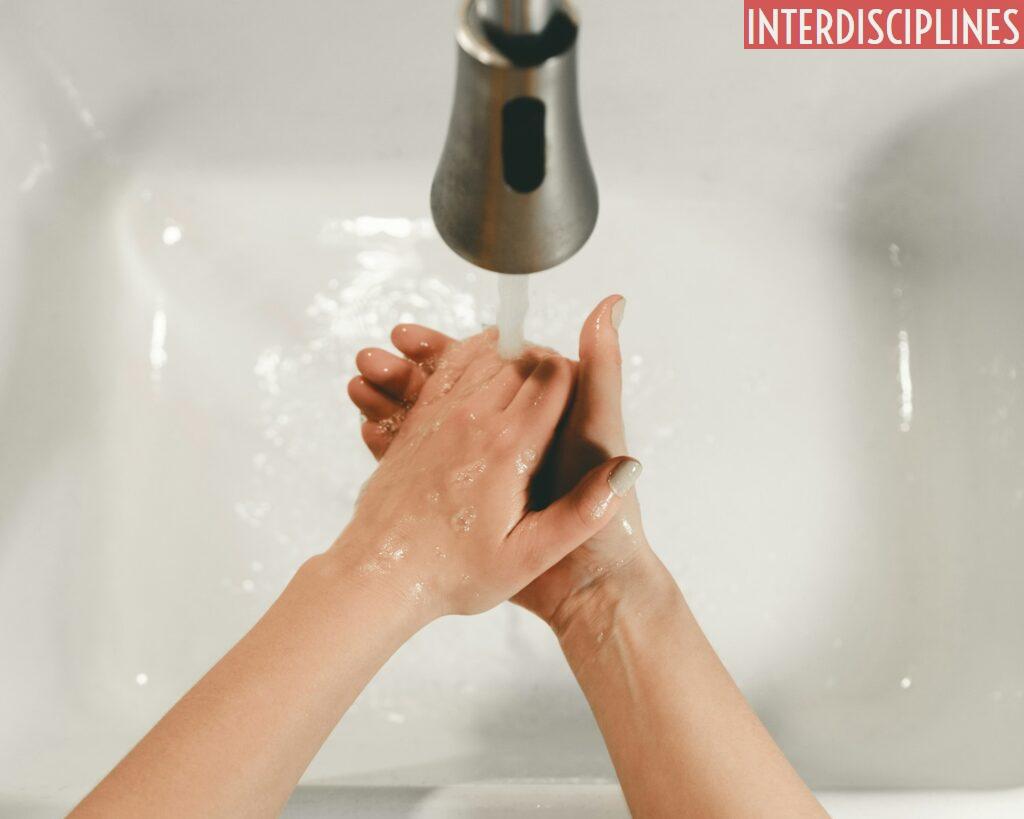 persons feet on white bathtub