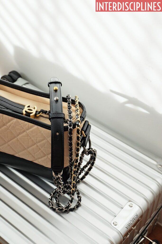 brown and black leather sling bag